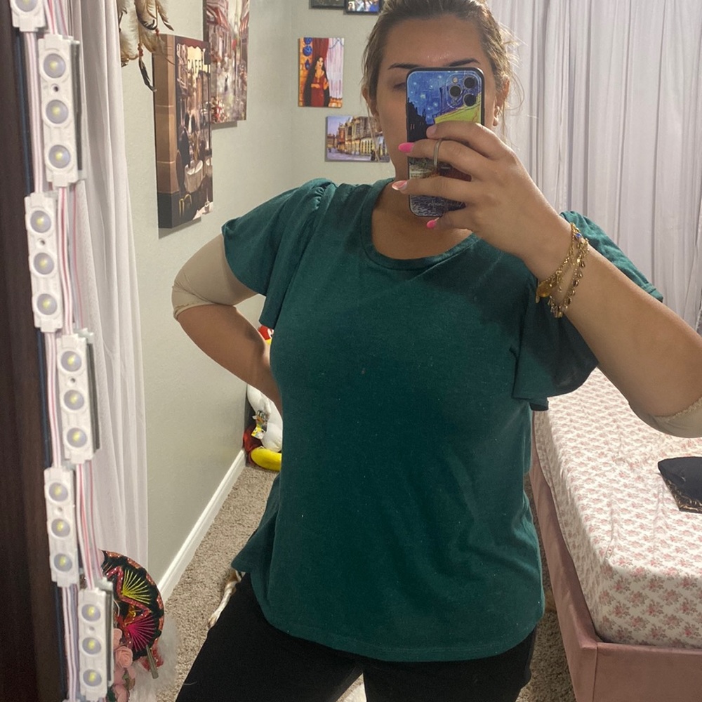 Emerald green top, very elegant, I bought it from Macy’s, made in Jordan